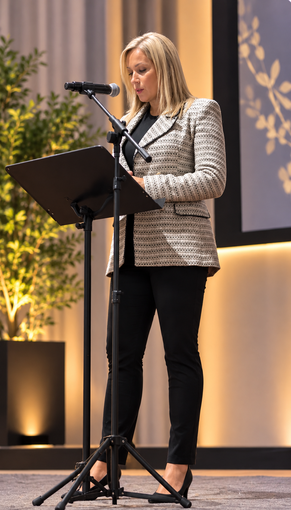 Jennifer Vokey speaking at a podium